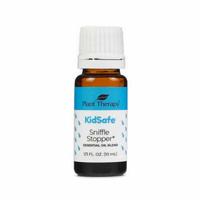 Plant Therapy Sniffle Stopper KidSafe Essential Oil Blend, 10 mL bottle. The amber glass bottle has a white cap and a blue and white label with small raindrop illustrations. Designed to support clear breathing and congestion relief, part of Plant Therapy's KidSafe line.