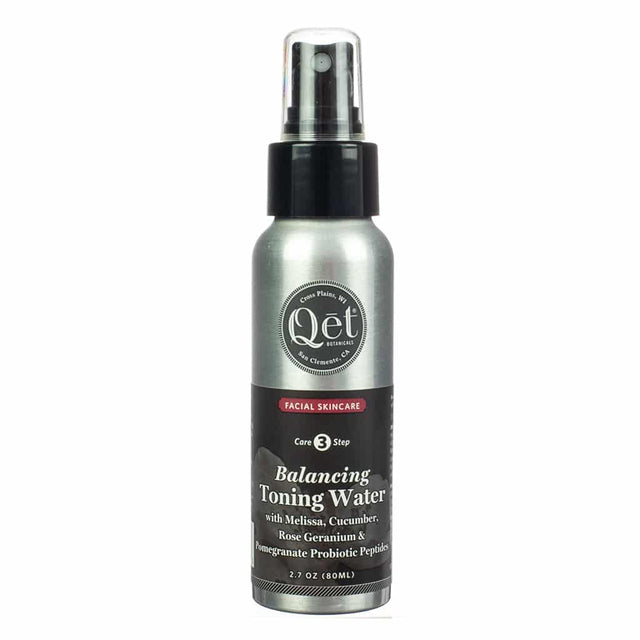 sleek metallic spray bottle labeled "Qet Botanicals Balancing Toning Water," featuring Melissa, cucumber, rose geranium, and pomegranate probiotic peptides for facial skincare as part of a three-step routine.