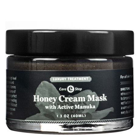 A black glass jar labeled "Qet Botanicals Honey Cream Mask with Active Manuka," a luxury treatment designed for deep hydration and skin rejuvenation. Contains 1.3 oz (40 ml) and is suitable for all skin types.