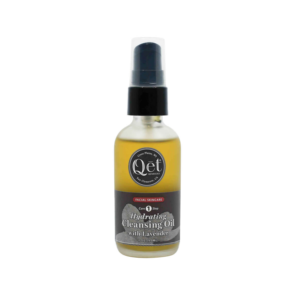 A 2 oz frosted glass pump bottle of Qēt Botanicals Hydrating Cleansing Oil with Lavender, labeled as Core Step 1 in a facial skincare routine. The golden-toned oil is housed in a sleek bottle with a black and gray label, designed to gently cleanse and moisturize the skin.
