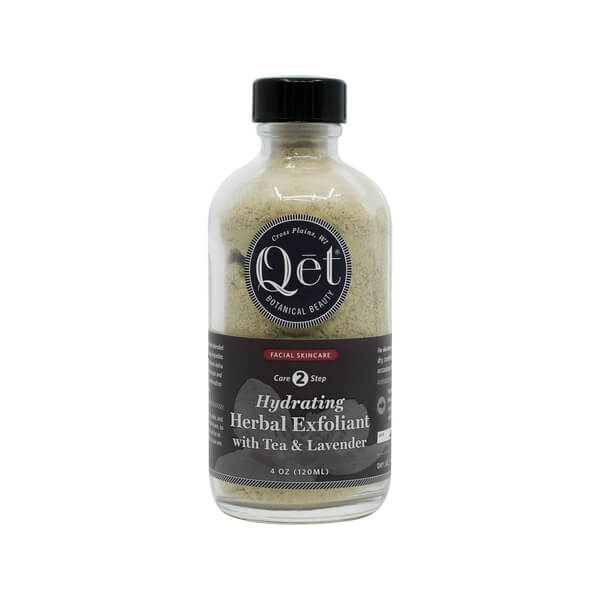 A 4 oz glass bottle of Qēt Botanical Beauty Hydrating Herbal Exfoliant, labeled as Core Step 2 in a facial skincare routine. The product features tea and lavender for gentle exfoliation and hydration, with a natural powdery texture visible through the clear bottle.