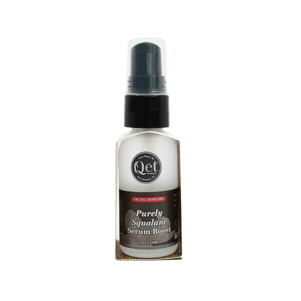 A 1 oz glass pump bottle of Qēt Botanicals Purely Squalane Serum Boost labeled for facial skincare. The design features a dark label with white and red text, highlighting it as a lightweight serum meant to nourish and hydrate the skin. 