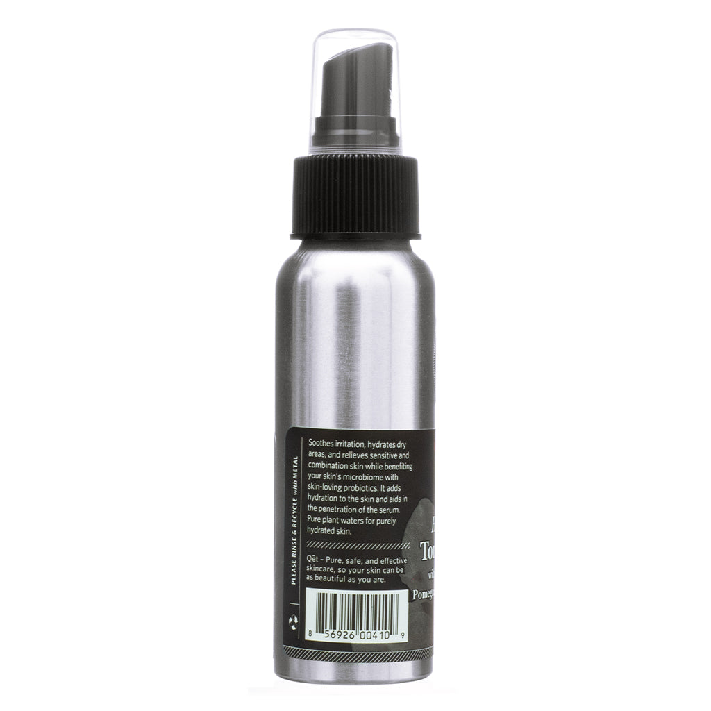 Back of a silver spray bottle with a black pump, featuring a label that highlights its soothing, hydrating, and probiotic-infused formula for sensitive and combination skin. The product claims to support the skin’s microbiome, enhance hydration, and improve serum absorption using pure plant waters.