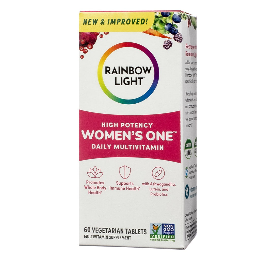 A white box with a colorful design labeled "Rainbow Light Women's One High Potency Daily Multivitamin," promoting whole body health, immune support, and probiotics. Contains 60 vegetarian tablets and is non-GMO certified.