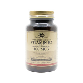 Solgar Vitamin K2 100 mcg natural vegetable capsules in dark amber bottle with beige label, 50 count