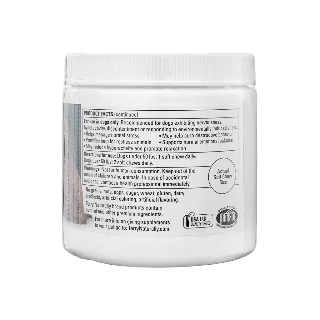 The back label of a Terry Naturally Calm Chew jar, detailing product facts, usage directions, and warnings. The product is recommended for dogs experiencing nervousness, hyperactivity, or environmental stress and helps manage normal stress, reduce hyperactivity, and curb destructive behavior. Directions suggest 1 soft chew daily for dogs under 50 lbs and 2 chews daily for dogs over 50 lbs. The label highlights no artificial ingredients, grains, or dairy and includes safety warnings for non-human consumption