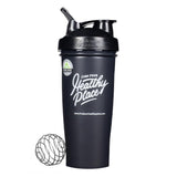 Matte black BlenderBottle featuring 'Find Your Healthy Place' branding and a genuine product seal. The bottle has a flip-top spout and includes a wire whisk ball for mixing drinks or supplements.