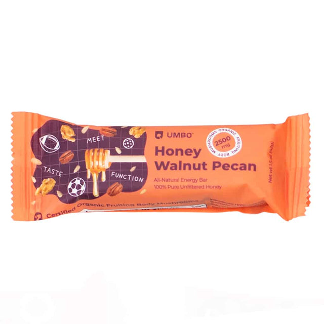 A bright orange wrapper showcasing the Umbo Honey Walnut Pecan energy bar. The packaging features illustrations of honey, walnuts, and pecans with the tagline "Meet Taste Function" and highlights 2500mg of organic mushroom fruiting body extract.