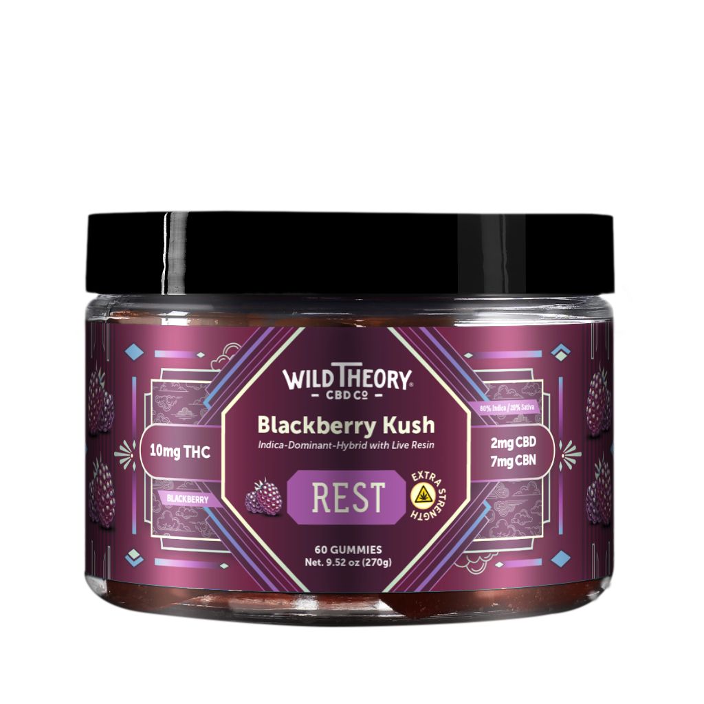 Wild Theory Blackberry Kush REST 10mg THC Gummies 60 Gummies, front label view. The jar features a purple gradient geometric design with Wild Theory CBD Co. branding and “Blackberry Kush – REST” messaging. It lists 10 mg THC per gummy, 2 mg CBD, and 7 mg CBN, with blackberry imagery and an extra strength badge. The label specifies 60 gummies.