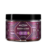 Wild Theory Blackberry Kush REST 10mg THC Gummies 60 Gummies, front label view. The jar features a purple gradient geometric design with Wild Theory CBD Co. branding and “Blackberry Kush – REST” messaging. It lists 10 mg THC per gummy, 2 mg CBD, and 7 mg CBN, with blackberry imagery and an extra strength badge. The label specifies 60 gummies.