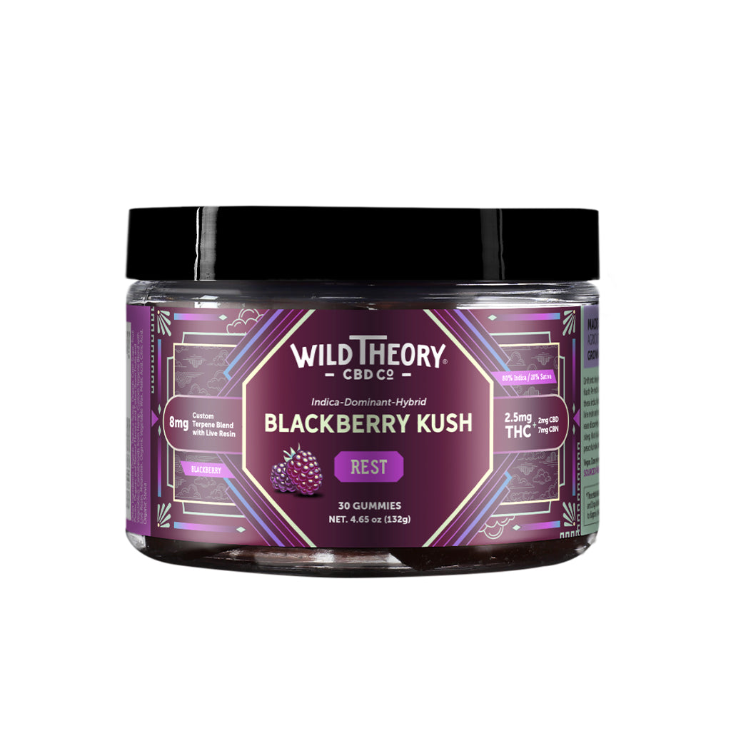 A jar of Wild Theory CBD Co. REST Blackberry Kush gummies, showcasing a deep purple label with a decorative geometric design. The brand name "Wild Theory CBD Co." appears at the top, with "Indica-Dominant Hybrid" and "Blackberry Kush" beneath it. The label features "REST" in a purple box and states "8mg Custom Terpene Blend with Live Resin." Dosage details read "2.5mg THC (2mg CBD, 7mg CBN)" per serving. The jar contains "30 Gummies" with a net weight of "4.65 oz (132g)." The label also includes an "Indica 