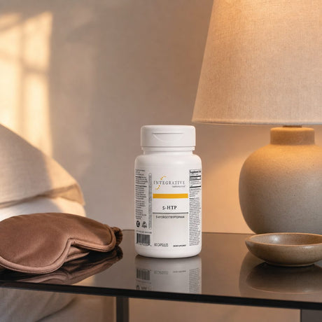 Integrative Therapeutics 5-HTP 50 mg bottle beside capsules on a clean countertop