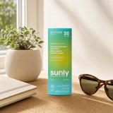 Woman applying Attitude Mineral Sunscreen Face Stick SPF 30 outdoors