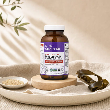New Chapter Bone Strength Take Care bottle with slim tablets and plant calcium callouts