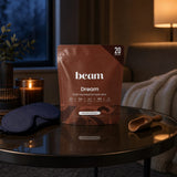 Beam Dream Powder Brownie Batter pouch beside a prepared mug of cocoa
