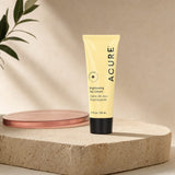 Acure Brightening Day Cream 1.7 fl oz tube shown with brightening skincare graphics