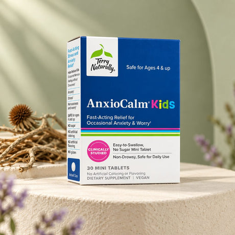 Terry Naturally AnxioCalm Kids box on a stone pedestal beside dried roots and lavender