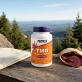 NOW Foods TMG Betaine 1000 mg tablets bottle on counter with water glass