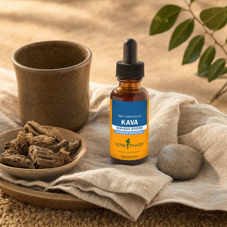 Herb Pharm Kava tincture bottle with dropper near a glass of water