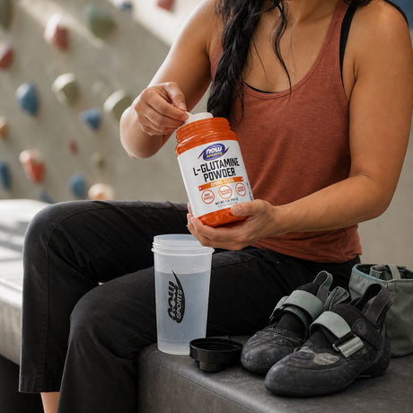 NOW Foods L-Glutamine Powder serving mixed into juice for an amino acid routine