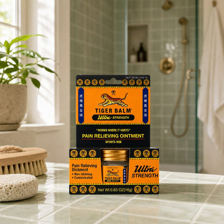 Man applying Tiger Balm Ultra Strength Pain Relieving Ointment to his shoulder