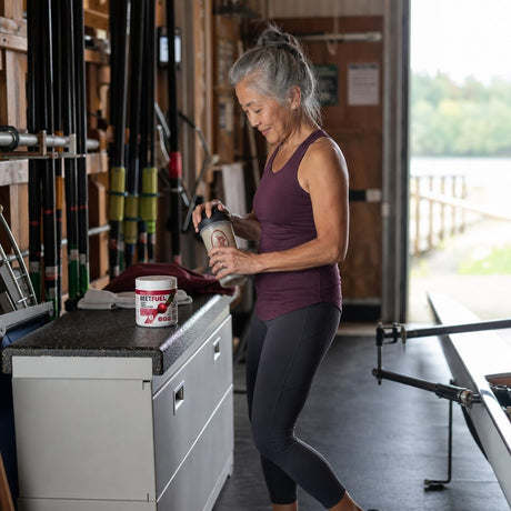Bionox BeetFuel Powder tub displayed with a prepared red watermelon drink