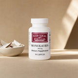 Ecological Formulas Monolaurin 300mg capsules bottle beside a glass of water on a counter