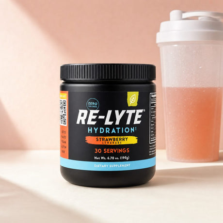 Redmond Re-Lyte Strawberry Lemonade jar with prepared pink mineral drink in a glass