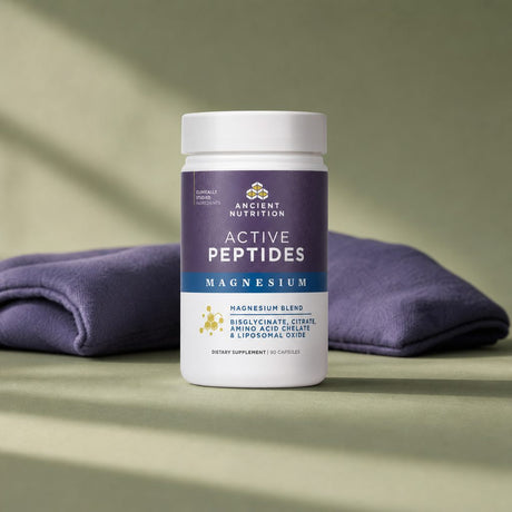 Woman relaxing at home with Ancient Nutrition Active Peptides Magnesium Complex bottle nearby