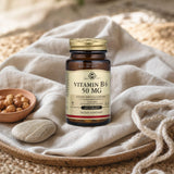 Solgar Vitamin B6 50 mg Tablets bottle on a kitchen counter beside a simple morning routine