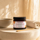 Mad Hippie MicroDermabrasion Facial open jar with cream scrub texture and pink flowers