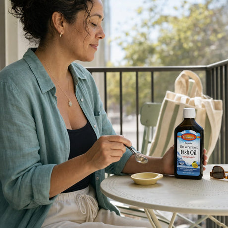 Carlson The Very Finest Fish Oil Lemon bottle on kitchen counter with natural lemon flavor callout