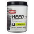 Hammer Nutrition HEED 2.0 High Energy Electrolyte Drink in Lemon Lime flavor, 32 servings. The packaging highlights it as corn-free, non-acidic, and non-GMO, with powdered drink mix details.