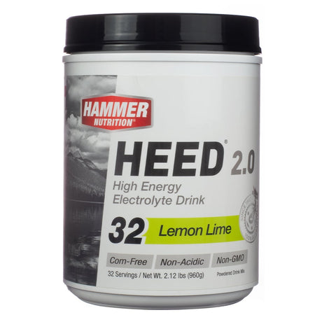 Hammer Nutrition HEED 2.0 High Energy Electrolyte Drink in Lemon Lime flavor, 32 servings. The packaging highlights it as corn-free, non-acidic, and non-GMO, with powdered drink mix details.